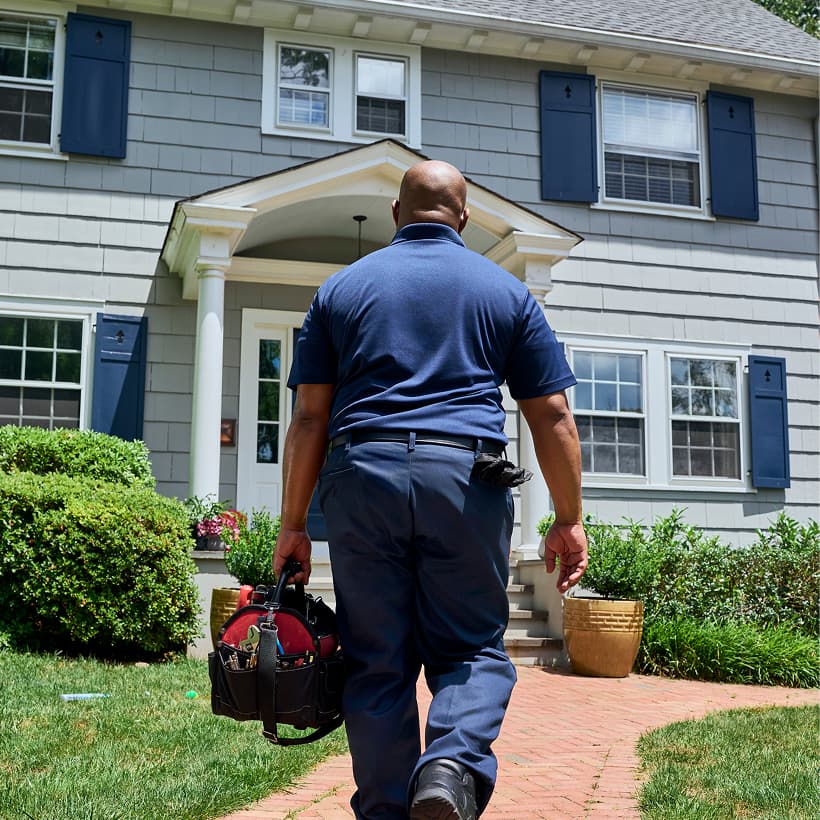 An Elite technician arrives at a home ready to provide expert HVAC, plumbing, and electrical services.